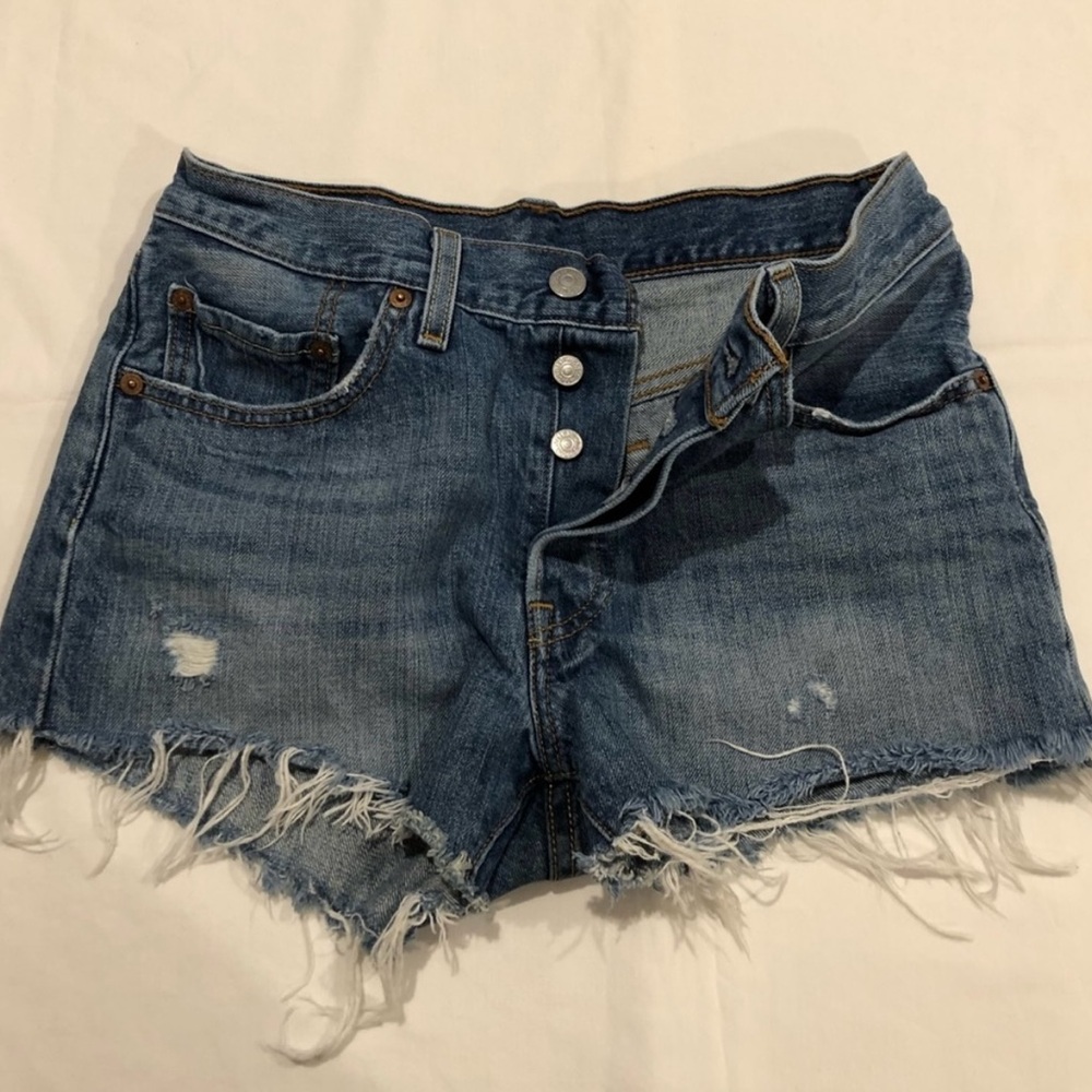 Levi’s button fly denim shorts. Women’s size 26. Frayed Hem.